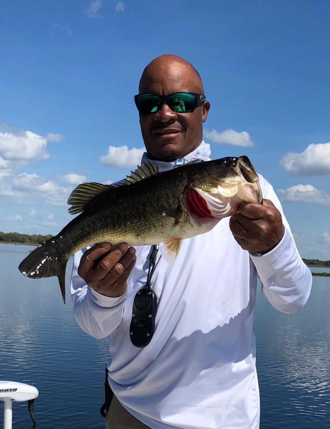 Hooked the prize Bass on a sunny Florida lake.