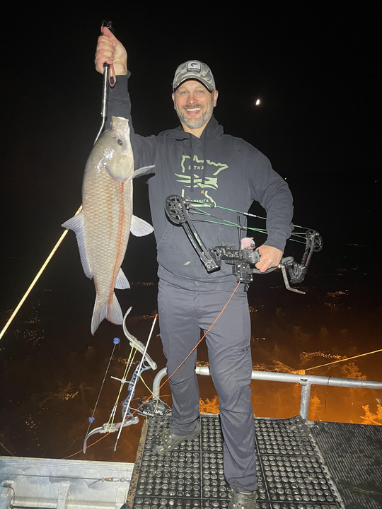 Exciting night bow fishing adventure with a great catch using heavy tackle in Lakeland!