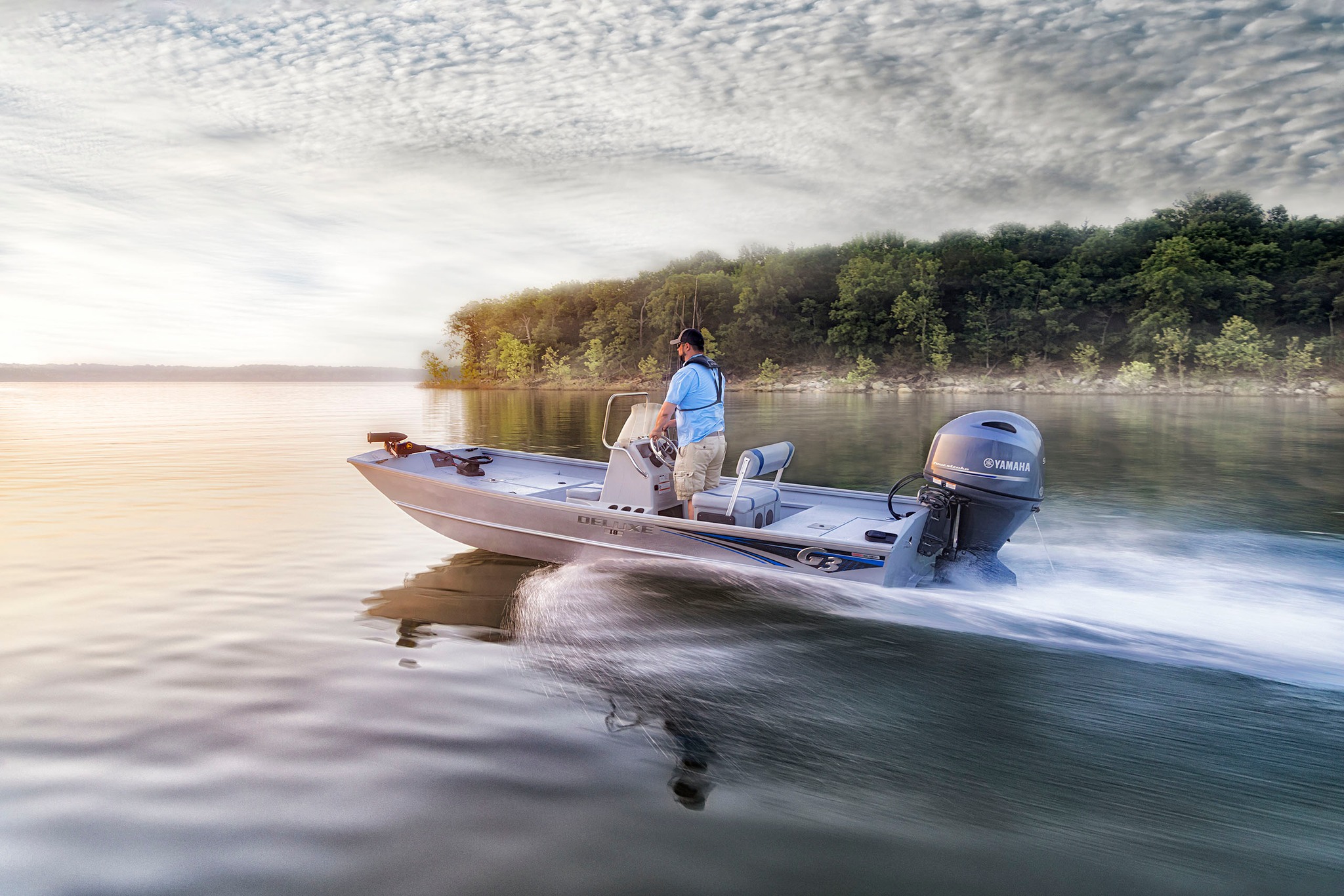 Powerful G3 fishing boat cutting across the water at sunrise!