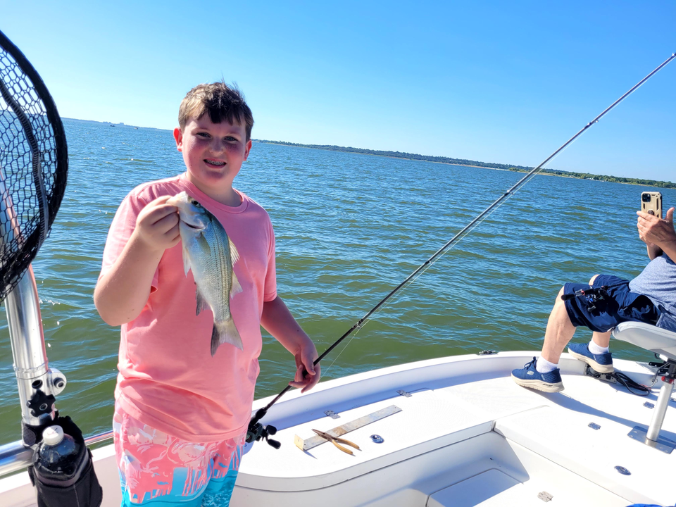 Reeling in a 12-inch White Bass on a clear day!