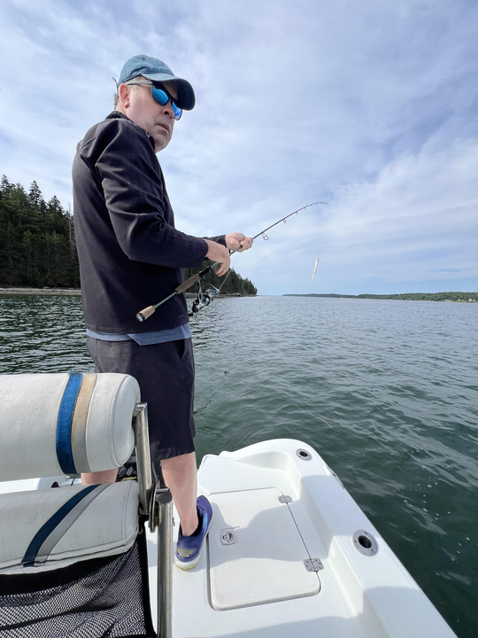 Casting for the best catch under partly cloudy skies at Damariscotta!