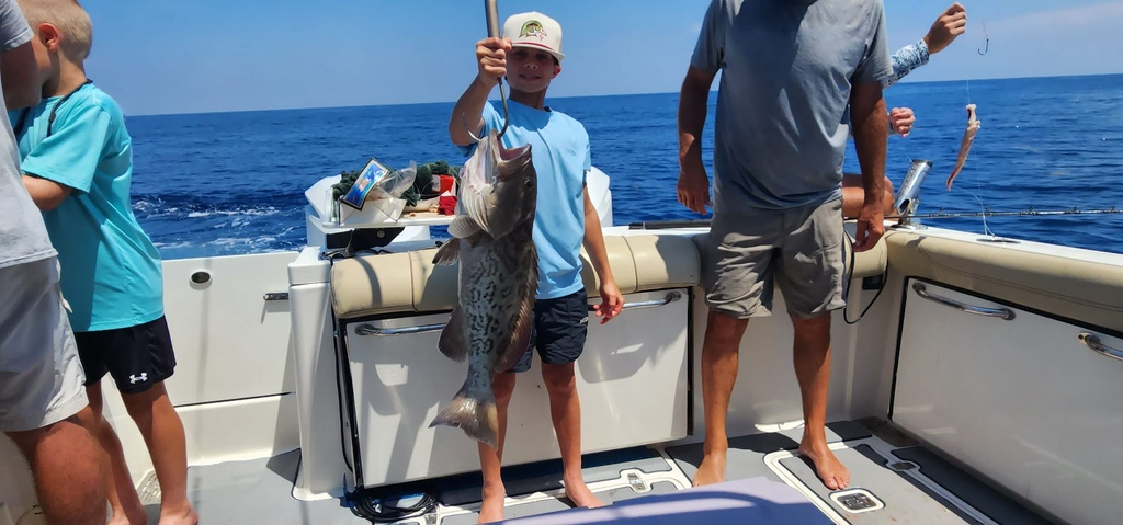 Proud young angler! Gag Grouper catch, Carrabelle family fishing charter