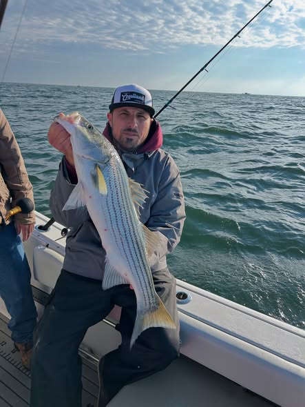 Solid Striper Reeled in - Point Pleasant, NJ.