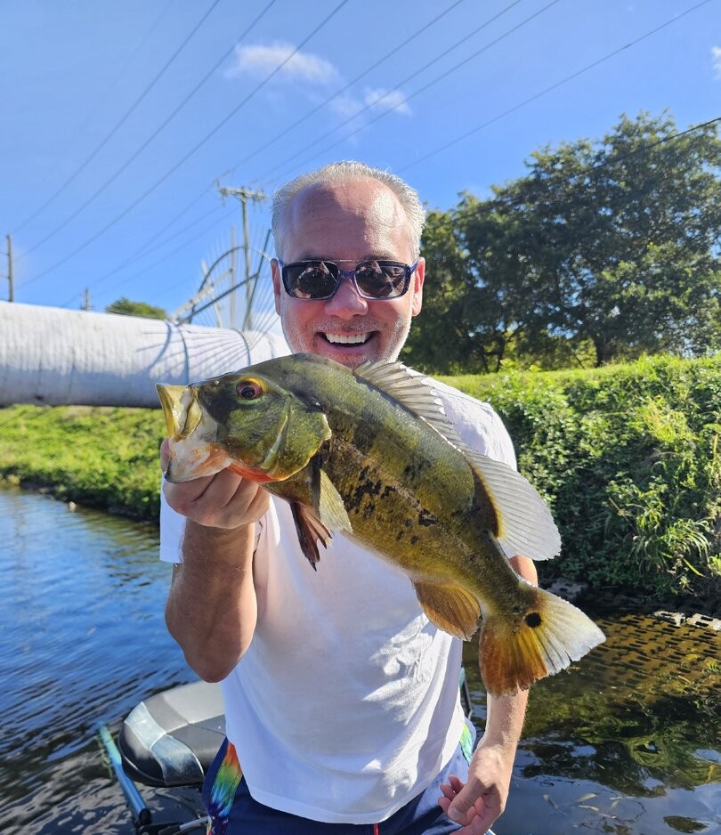 Freshwater fishing in Delray Beach, FL with nonstop peacock bass action in scenic South Florida canals.