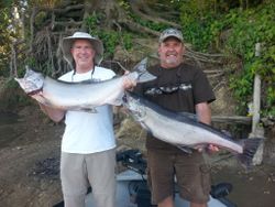 Two people fishing in California with 2 big fish