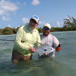 Permit fish caught by two people fishing in NY