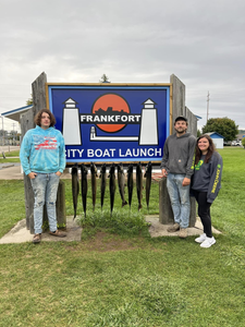 Three people enjoying a fishing trip in Frankfort