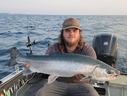 Angler with a rainbow trout, caught in MI