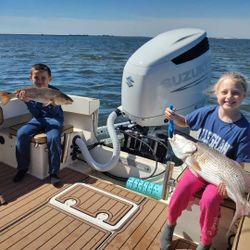 Two anglers enjoying a fishing trip in North Carolina