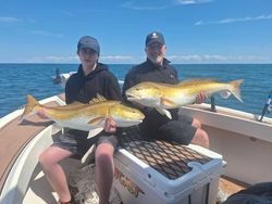 2 anglers catching big fish in Wanchese