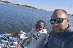 Two people enjoying a fishing tour in North Carolina