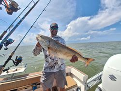 Fisherman holding large fish in Wanchese