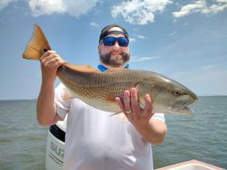 A redfish measuring 22 inches caught while fishing in NC