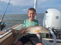 Redfish being reeled in during a fishing tour in NC