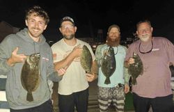 Three summer flounder fish caught during a fishing tour in NC
