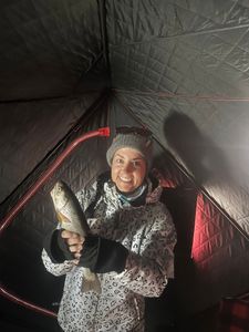 Ice fishing catch displayed inside winter fishing shelter in Rifle Colorado