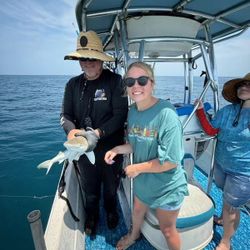 Two anglers with a caught fish in Florida