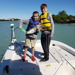 Two people enjoying a day of fishing in Placida