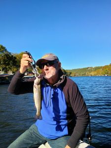 Angler with a rainbow trout in Branson, Missouri
