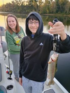 Angler catches a rainbow trout in MO