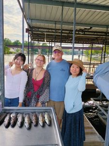 Four people fishing in Branson, Missouri