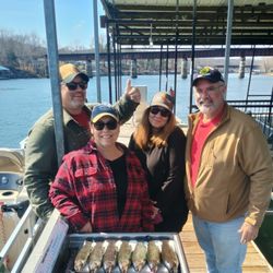 4 people enjoying a fishing trip in MO