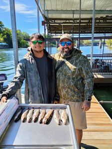 Two people fishing in Branson