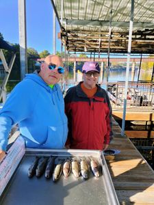 Two people fishing in Branson