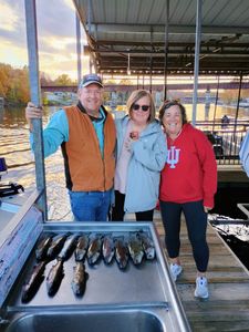 Three people enjoying fishing in Branson