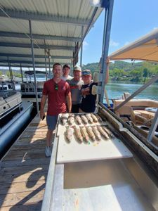 Group of 4 people fishing in Branson