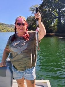 Angler with a fishing rod enjoying the outdoors in Branson