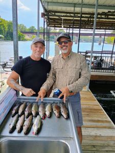 Two people fishing in MO