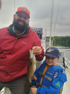 Two people fishing in Branson