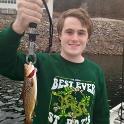 Angler with a fishing rod enjoying the outdoors in Branson