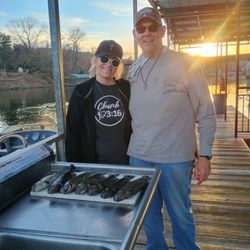 Two people fishing in MO