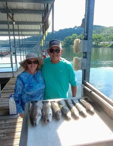 4 rainbow trout caught by 2 people fishing in Branson