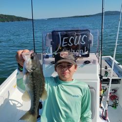 Angler holding a spotted bass fish in Missouri