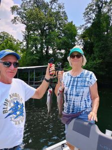 Two people fishing in Branson