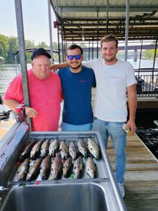 Three people enjoying a great fishing trip in MO