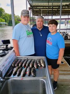 Three people enjoying a fishing trip in MO