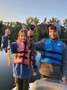 Two anglers fishing for rainbow trout in Branson