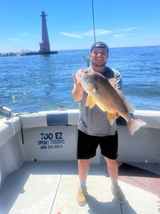 1 person with rod fishing in MI