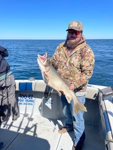 Angler holding big fish in MI
