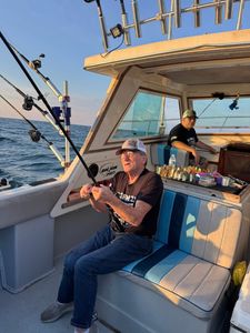 Two people fishing in MI