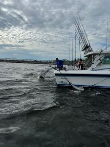 Two people enjoying a great fishing cruise in MI
