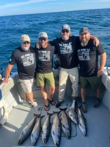 Four anglers casting fishing lines in Muskegon, Michigan