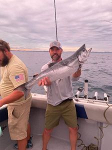 Two people enjoying a cruises and fishing adventure in Muskegon