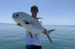 A lone fisherman in Islamorada, holding a 22-inch catch