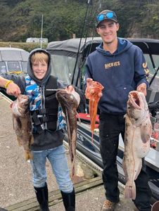 Successful fishing trip in Roseburg Oregon showing caught lingcod and other fish species