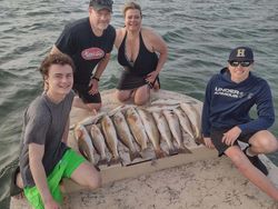 5 fishing rods in action against the backdrop of South Padre Island